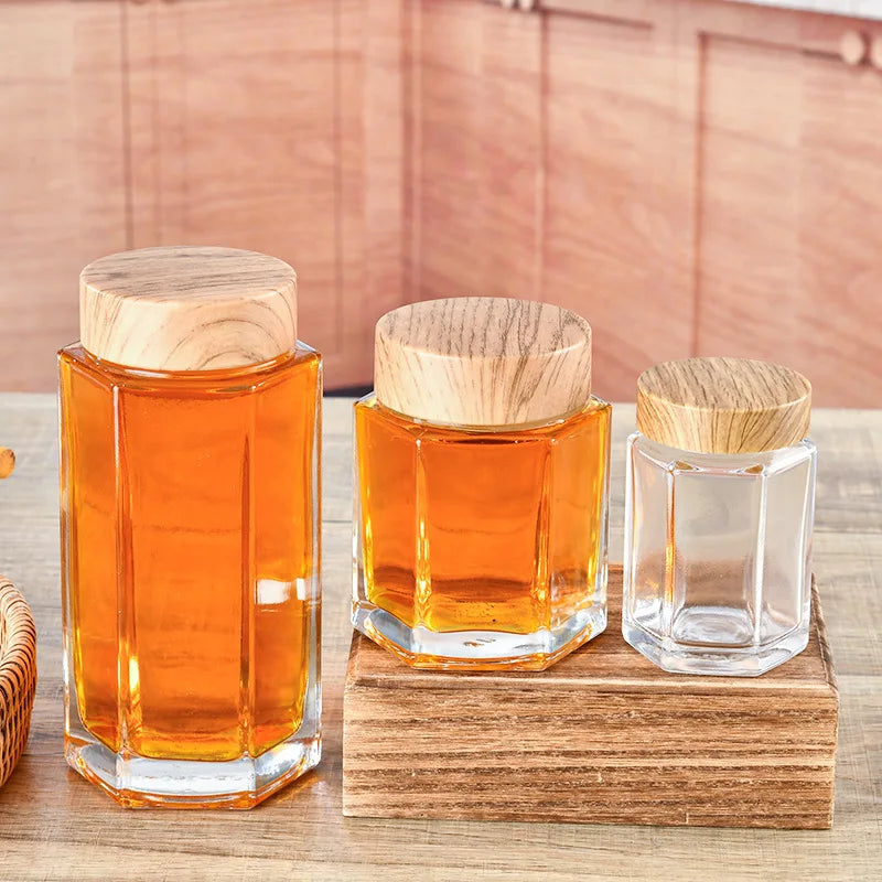 Wholesale Six Hexagon Glass Honey Bottle With Wood Grain Lid Thickened Round clear Glass Jam Jar
