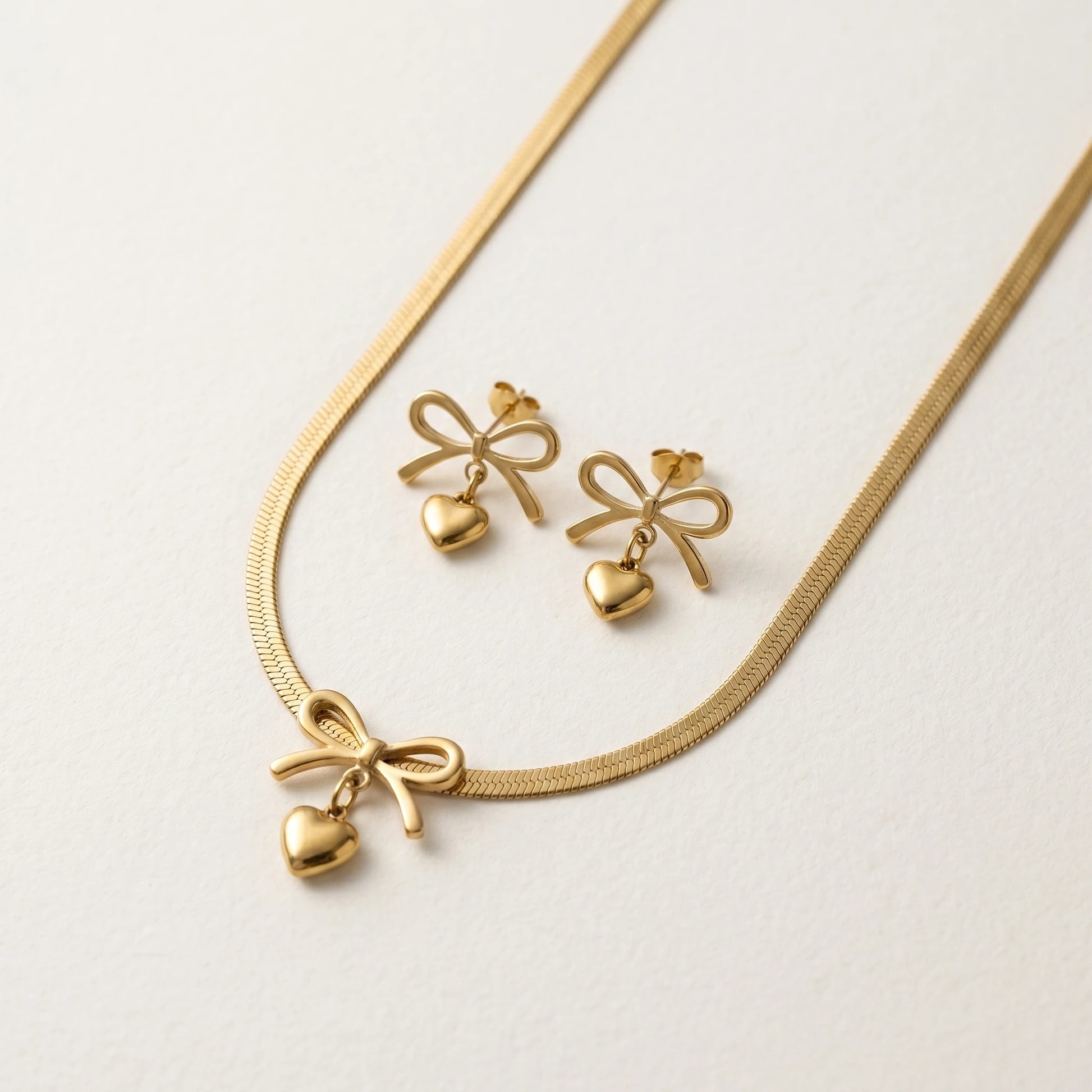 QIAOREN 11686 Tarnish Free 18K Gold Stainless Steel Bow & Heart Jewelry Set Herringbone Necklace & Earrings