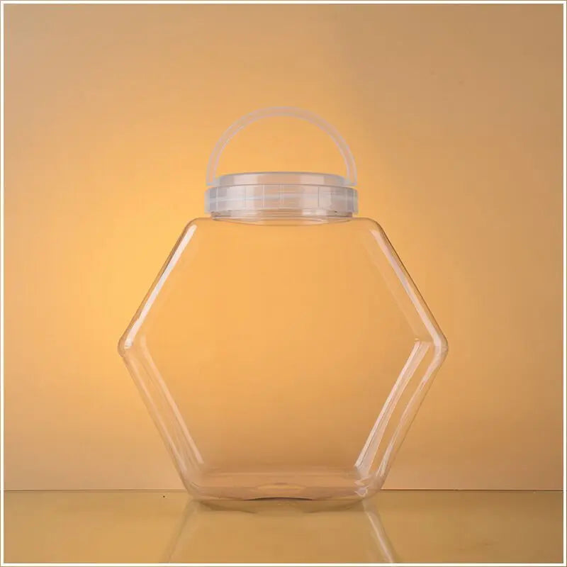 Customized Logo Factory 30 Ounces 850ml 1500ml Plastic Hexagonal Pet Fishbowl Candy Jar with White Cap for Chocolate Chewing 