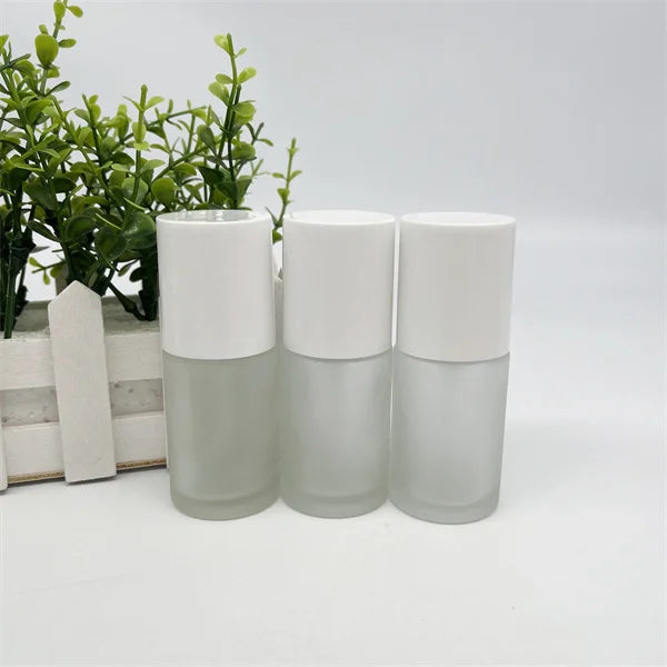 2022 New Design Frost Custom Cylinder Liquid Foundation Glass Liquid Foundation Bottle 30ml Skincare Lotion Bottle with Pump 