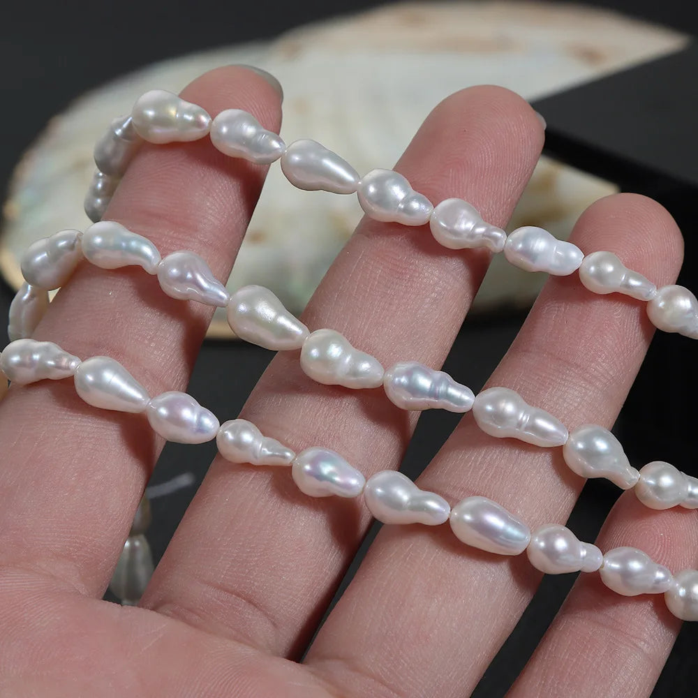 Wholesale Strong Light 5-6mm Water Droplets Size White Baroque Nucleus Irregular Fireball Shape Freshwater Pearl Beads Strand