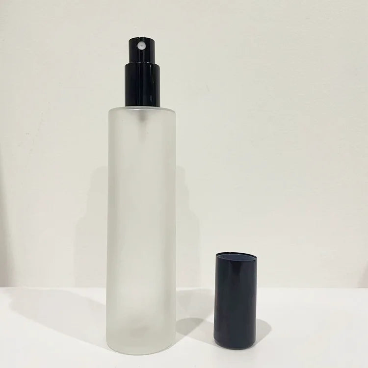 Wholesale 100ml Flat Shoulder Cylinder Room Spray Bottle White Cosmetic Packaging Glass Cosmetic Lotion Pump Bottle