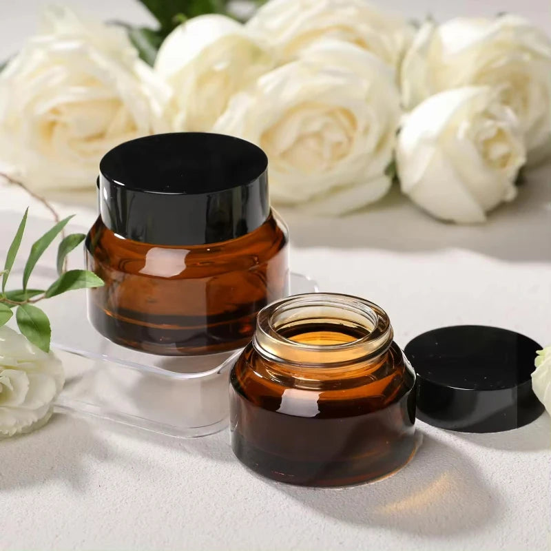 Eco-friendly Glass Cosmetic Jar 50ml Amber Packaging with Matte Black Gold Cap Custom Printing Plastic Option