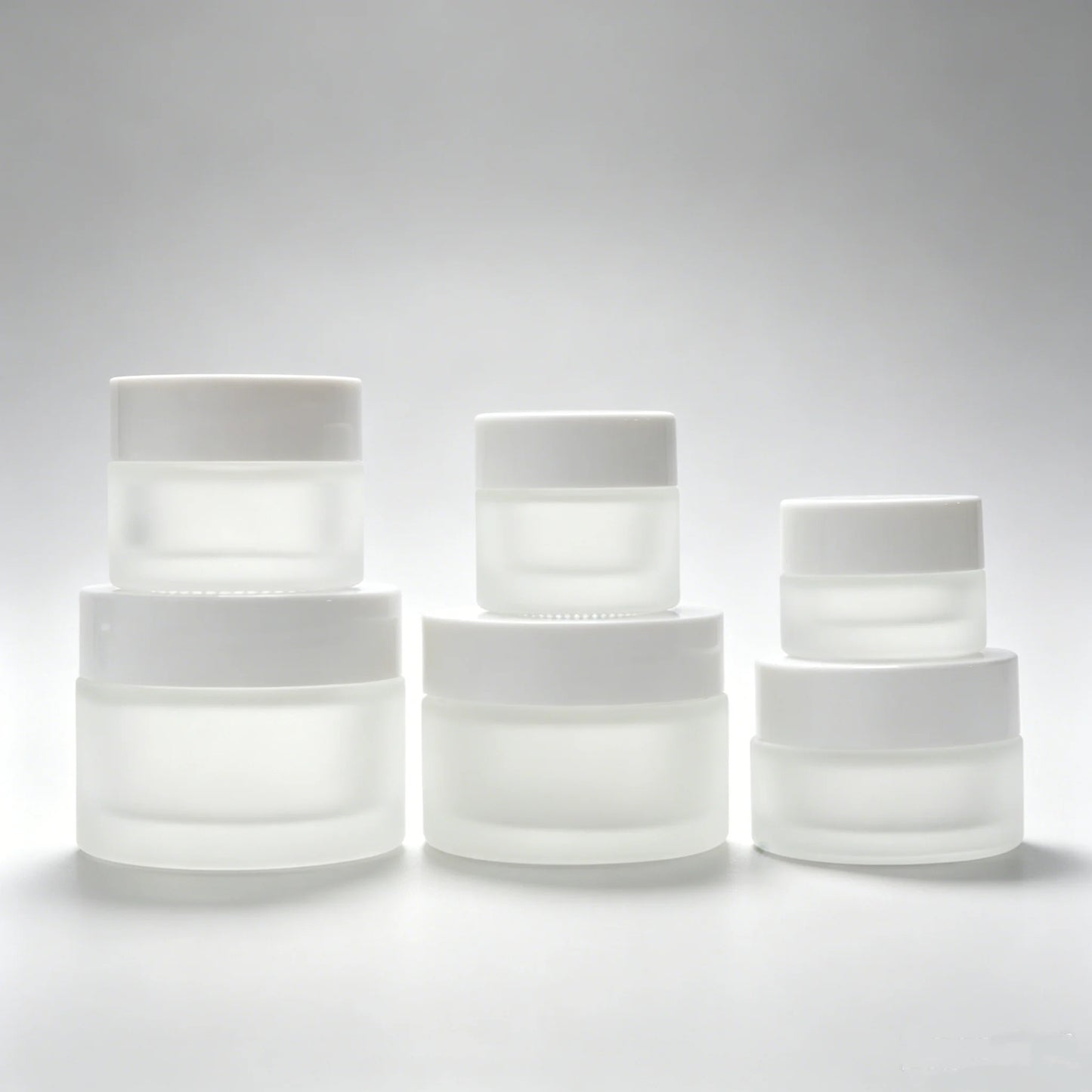 Customized Luxury Frosted Cosmetic Glass Cream Jars 50ml 50g Frosted Glass Eye Facial Cream Jar with White Plastic Lids
