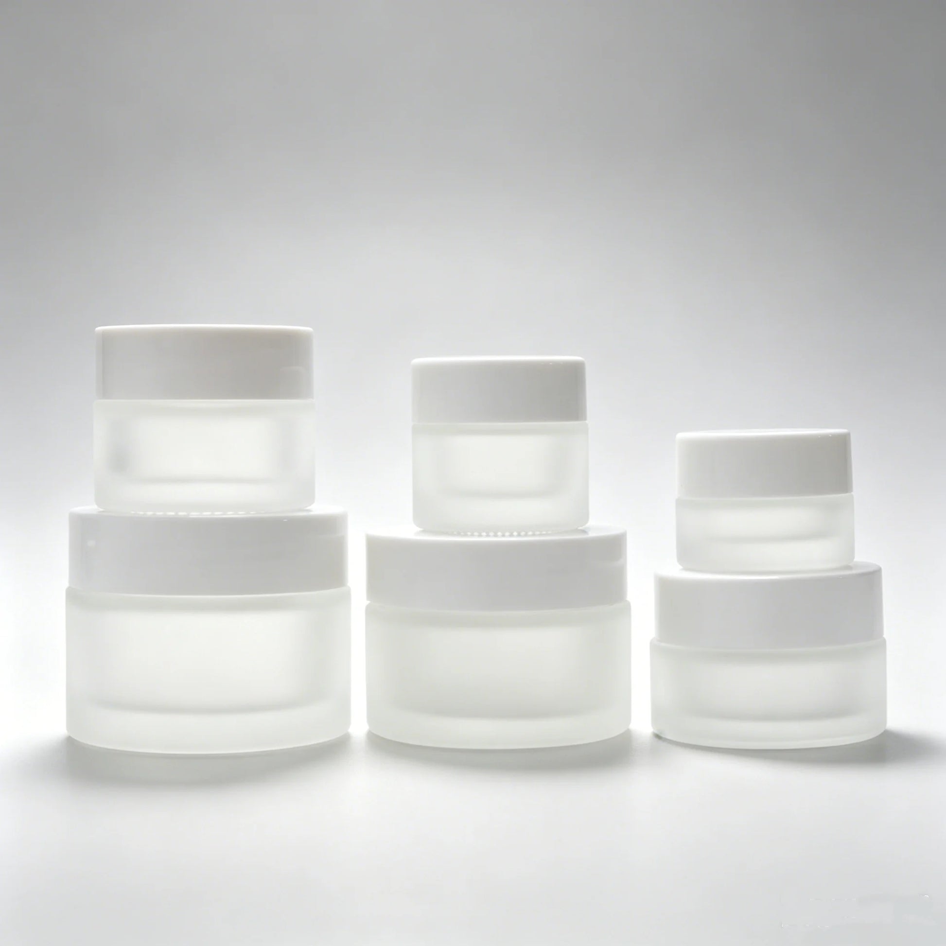 Customized Luxury Frosted Cosmetic Glass Cream Jars 50ml 50g Frosted Glass Eye Facial Cream Jar with White Plastic Lids