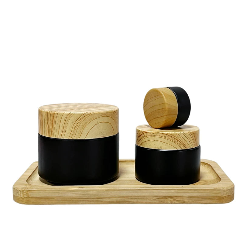 In Stock Wholesale 5/10/15/20/30/50G Matte Black Face Cream Jar Containers 1 2 4 Oz Glass Jars With Plastic Wood Grain Lid