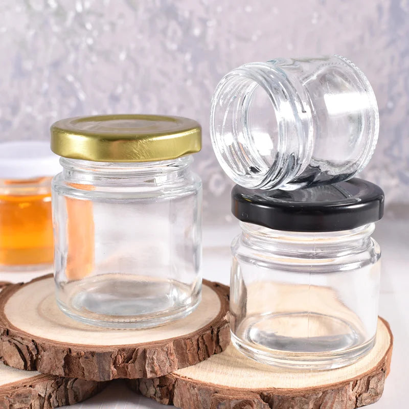 Wholesale 55ml Empty Round clear Food Storage Bottle Honey Glass Jar Glass with  Metal Screw Lug Lids