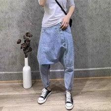 Hombres Moda Pantalones de mezclilla Harén Pantalones sueltos Irregulares Caída Entrepierna Jeans Cónicos