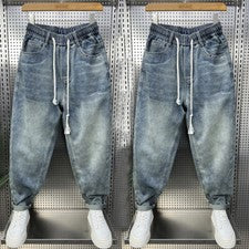Pantalones de mezclilla harén ajustados con cordón de moda para hombre 2025 primavera informales