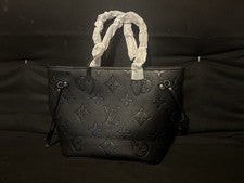 Bolso de mano Louis Vuitton negro con monograma