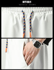 Pantalones cortos deportivos sueltos finos de moda informales a juego de colores de tendencia para hombre