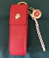 Estuche/llavero RMS Beauty Legendary Lip Oil “Be Legendary” rojo con detalles dorados