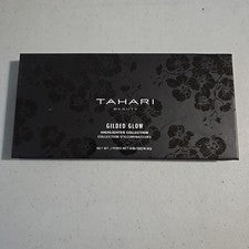 Colección de iluminadores Tahari Beauty dorado resplandor nuevo .65 OZ compacto con espejo