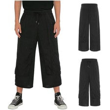 Pantalones informales de pierna ancha para hombre, culottes de cintura elástica estilo Harajuku con bolsillos