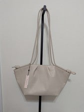 Bolso de hombro BCBGeneration para mujer Bolso acampanado con cordón de hueso $118