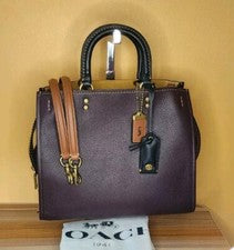 Cartera de mano Coach ROGUE 30 MTO en bloques de colores