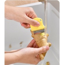 Pelador de verduras de acero inoxidable con orificio para colgar para facilitar su almacenamiento