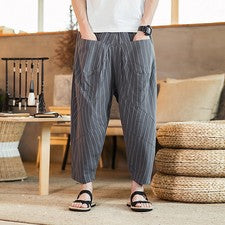 Pantalones de salón sueltos de pierna ancha a rayas de moda de algodón y lino para hombre