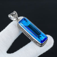 Colgante largo suizo de plata de ley 925 con piedras preciosas de topacio azul hecho a mano
