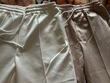 2 piezas Pantalones informales para hombre europeos y americanos de moda color liso con cordón