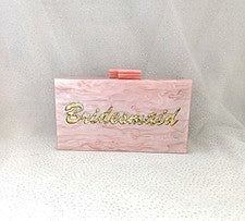 Bolso clutch de dama de honor de acrílico rosa con estampado dorado y asa de cadena dorada