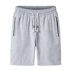Pantalones de playa deportivos informales de moda de cinco puntos sueltos delgados con cordón liso para hombre