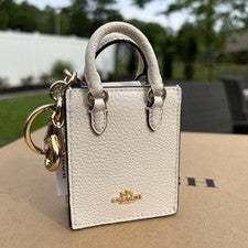 Mini bolso de mano Coach CU280 North South de cuero granulado encanto FOB dorado/tiza $138