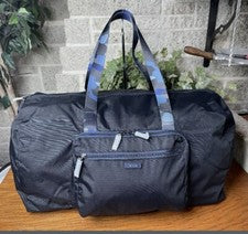BOLSO DE MANO DE VIAJE NUEVO CON ETIQUETAS TUMI AZUL MARINO CAMUFLAJE NEGRO LONA PLEGABLE