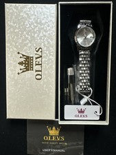 Reloj para mujer OLEVS cara plateada, correa plateada, fecha de día, cuarzo