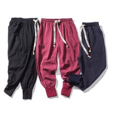 Pantalones harén pies pequeños de moda informales simples elásticos de algodón de lino para hombre