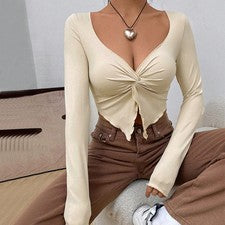 Nueva camisa de punto de moda retorcida con cuello en V para mujer 2025 manga larga