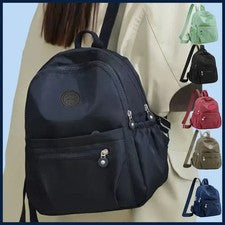 Mochila multicolor para dama con diseño de logotipo redondo de moda para mujer al hombro