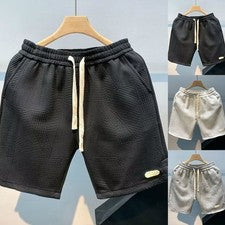 Pantalones cortos de cinco cuartos para hombre color liso cintura elástica cordón cómodos