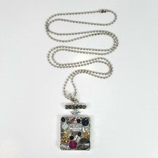 Collar largo colgante con forma de botella de perfume pedrería a base de tono plata N0188