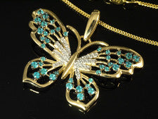 Colgante mariposa oro 585 con topacio azul cielo y circonitas 30 x 23 mm