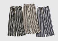 Pantalones largos holgados de entrenamiento a rayas informales de moda para hombre nuevos