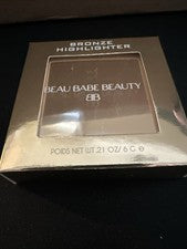 Iluminador de bronce Beau Babe Beauty • 0,21 oz • Libre de crueldad • Caja sellada