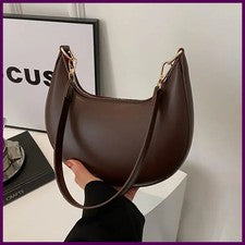 Nueva bolsa de béisbol de moda de alta gama en forma de luna, mostrando lujo, para mujer