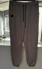Pantalón estilo jogger gris con puños con bolsillos y cuerdas talla XL para hombre