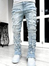 Pantalones de mezclilla estilo callejero elásticos medianos informales calce recto con borlas para hombre