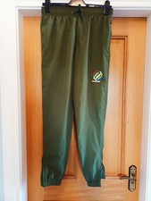Pantalones deportivos Storefront caqui forrados carcasa suave bolsillos con cremallera para hombre talla S