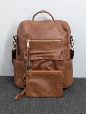 Elegante mochila convertible marrón colorida correa geométrica y muñeca a juego