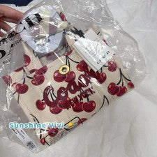 NUEVO CON ETIQUETAS COACH Bolso de Mano Carga 20 con Estampado de Cereza CZ104 Lona