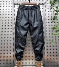 Pantalones ajustados de motociclista de cuero sintético para hombre de moda pantalones informales sueltos