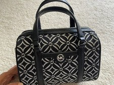 Bolso de Lona Michael Kors Jet Set Mediano Negro Plata Logo Plateado Metálico