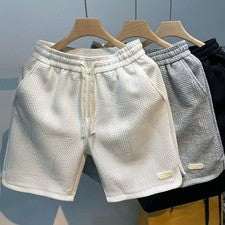 Pantalones cortos de cinco cuartos para hombre color liso cintura elástica cordón cómodos
