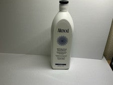 Champú reparador Aloxxi con complejo para el cuidado del color 33,8 oz