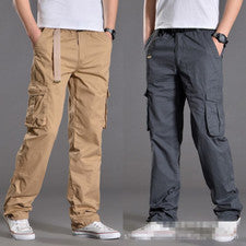 Mono de cintura elástica lisa de moda para hombre Bolso de varios botones Pantalones informales