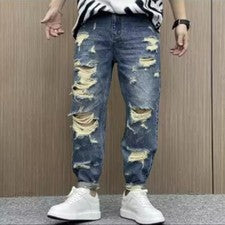 Nuevos Pantalones de mezclilla rectos retro desgastados para hombre con agujeros rasgados Pantalones de moda