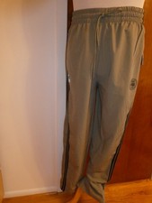 Pantalones de chándal deportivos grandes para hombre NBA verde oliva dobladillo con cremallera